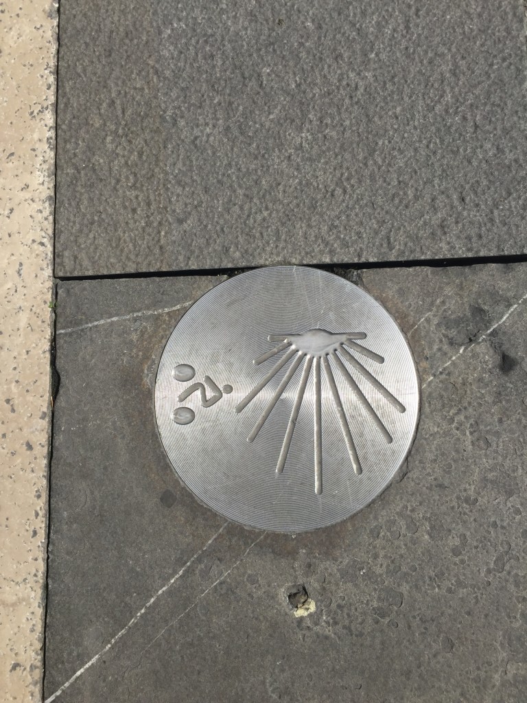 pilgrim path that runs through Pamplona marked with silver inserts in the road